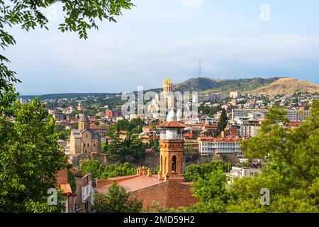Tbilisi old town with Jumah Mosque in sulfur baths district, Metekhi Church on bank of river Kura and Sameba Cathedral, Georgia. Popular tourist Stock Photo