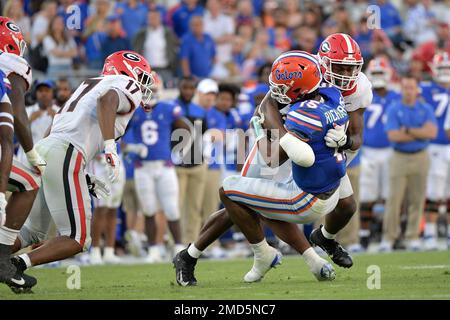 Florida quarterback Anthony Richardson (15) is tackled by Georgia