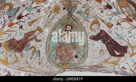 Christ sitting on his throne on judgment day. Virgin Mary and John the Baptist are at his side. En old fresco in Elmelunde church, Denmark, October 10 Stock Photo