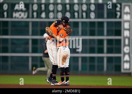 Houston Astros second baseman Jose Altuve (27) and shortstop Carlos Correa  laugh at the end of their 4-3 victory over the Oakland Athletics in a  baseball game, Wednesday, Aug. 31, 2016, in