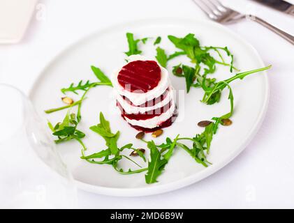 Beetroot salad dish with fresh goat cheese Stock Photo