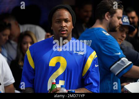 Rapper YG wears the jersey of Los Angeles Rams wide receiver Robert Woods  during the second