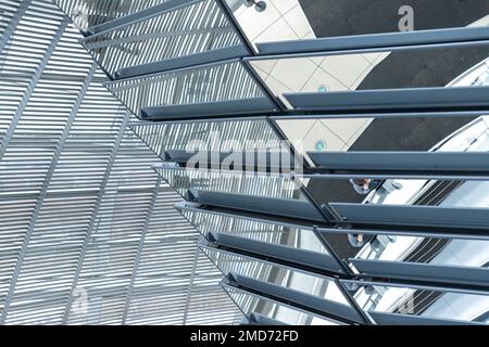 Inside the Bundestag dome. Tourists visit the parliament building of German government. Reichstag new dome interior. Stock Photo