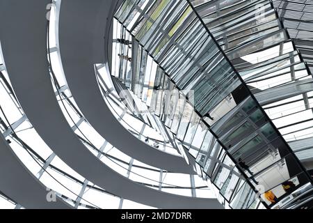 Inside the Bundestag dome. Tourists visit the parliament building of German government. Reichstag new dome interior. Stock Photo