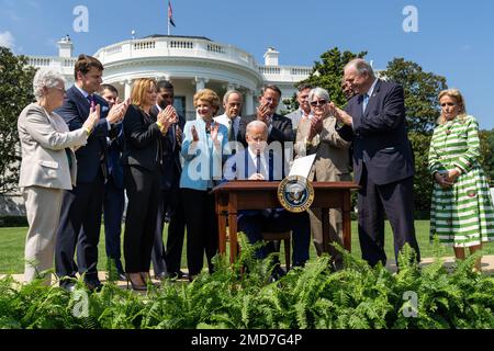 Reportage: President Joe Biden signs an executive order setting a goal for half of all new vehicles sold by 2030 to be zero emissions, Thursday, August 5, 2021, on the South Lawn of the White House. Stock Photo
