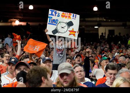 An avid Astros fan holds a birthday sign during the baseball game News  Photo - Getty Images