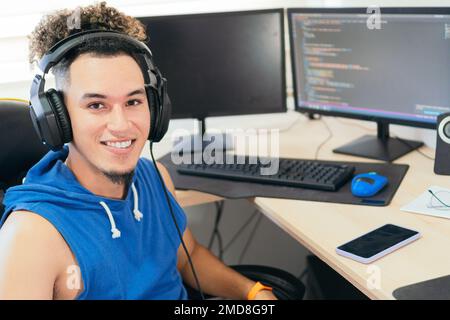 Portrait of a self-employed man working at home, looking at the camera smiling. Stock Photo