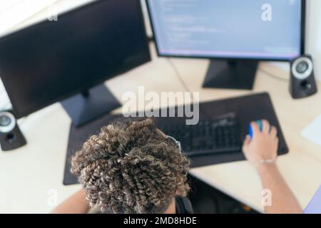 A developer busy coding shot from above Stock Photo