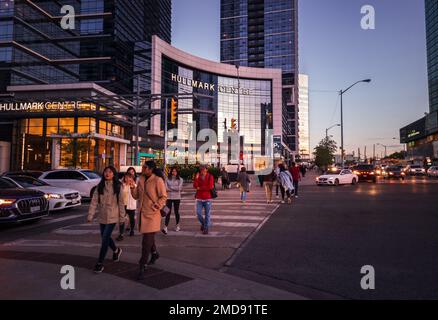 Toronto, Ontario, Canada - 09 23 2022: Pedestrians walking on a crosswalk at the intersection of Younge Street and Sheppard Avenue in North York Stock Photo