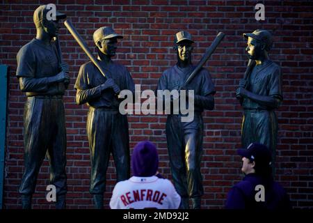 LOS ANGELES, CA - SEPTEMBER 12: A fan posing for a picture in front of  mural of Los Angeles Dodgers pitcher Joe Kelly (17) making his pouty face  mocking the Astros as