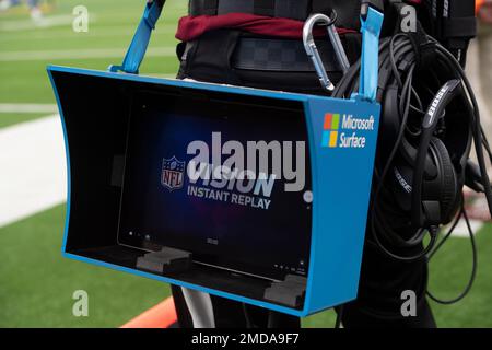 A Microsoft Surface is used for instant replays, on the sideline of an NFL  football game