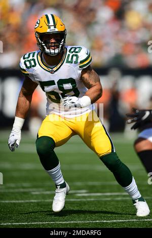 Green Bay Packers linebacker Isaiah McDuffie (58) picks up a loose ball  during an NFL football game against the Washington Commanders, Sunday, October  23, 2022 in Landover. (AP Photo/Daniel Kucin Jr Stock