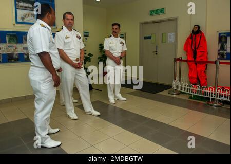 KOTA KINABALU, Malaysia (July 15, 2022) – Royal Malaysian Navy Capt. Kamalrulzaman bin Zainul, left, acting Submarine Force Commander and commanding officer of Submarine Training Centre, speaks with U.S. Navy Capt. John Frye, middle, commanding officer of the Emory S. Land-class submarine tender USS Frank Cable (AS 40), during a tour of the Submarine Command Headquarters on Sepanggar Naval Base in Kota Kinabalu, Malaysia, July 15, 2022. Frank Cable is currently on patrol conducting expeditionary maintenance and logistics in support of a free and open Indo-Pacific in the U.S. 7th Fleet area of Stock Photo