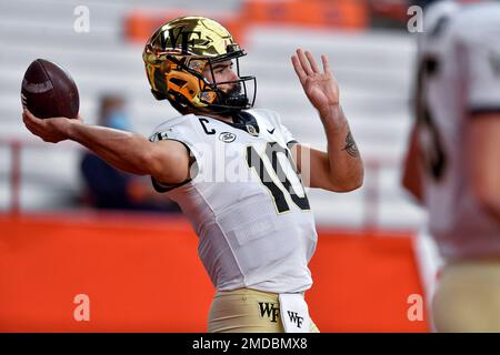 Wake Forest quarterback Sam Hartman (10) scrambles as he looks to pass ...