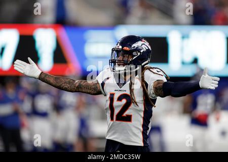 Denver Broncos defensive back Mike Ford (12) reacts against the