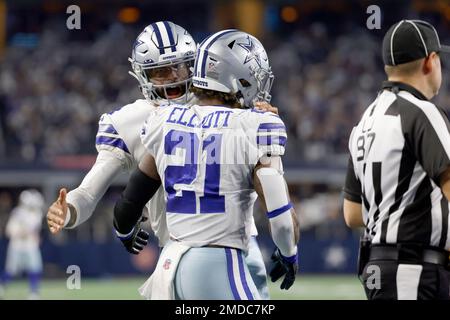 Dallas Cowboys running back Ezekiel Elliott (21) celebrates with Dallas  Cowboys quarterback Dak Prescott (4) after