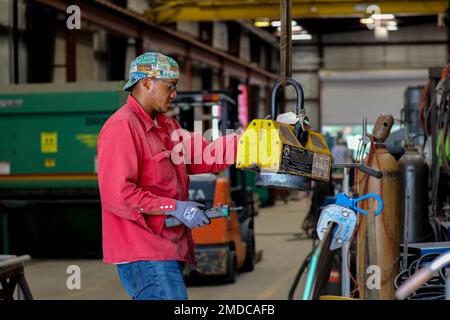 Michael Dunning Jr., a welder at the Army Corps of Engineers runs a PlateProX HD Large CNC Plasma/Oxy-fuel capable metal cutting machine, to cut out a 2 inch flange (donut) for the machinist to work on in the process of completing a off site project. Stock Photo