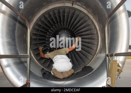 U.S. Air Force Staff Sgt. Narada Wakefield, 736th Aircraft Maintenance Squadron maintainer, inspects a C-17 Globemaster III engine during the Liberty Eagle Readiness Exercise at Dover Air Force Base, Delaware, July 15, 2022. Wakefield is one of many maintainers from the 512th and 436th airlift wings who worked together during a simulated deployment to a forward operating base, located on Dover AFB, July 11-15, 2022. The purpose of this exercise was to validate both wings' ability to generate, employ and sustain airpower across the world in a contested and degraded operational environment. Stock Photo