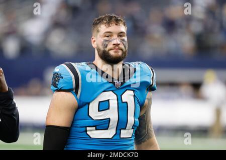 Carolina Panthers center Carolina Panthers defensive end Morgan Fox (91)  walks on the sidelines during an NFL football game against the Miami  Dolphins, Sunday, Nov. 28, 2021, in Miami Gardens, Fla. (AP