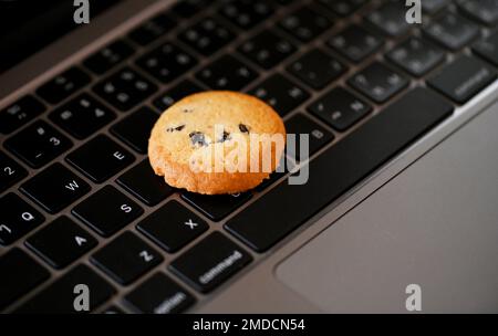 internet cookies internet browser cookies concept, mini cookies on keyboard computer laptop Stock Photo