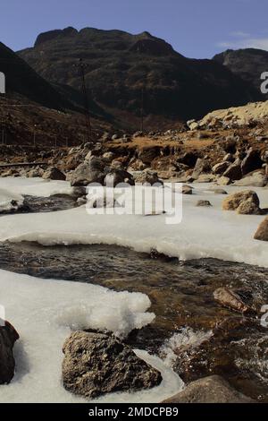 frozen mountain stream near sela pass, high himalayan pass is located near tawang hill station in arunachal pradesh, north east india Stock Photo