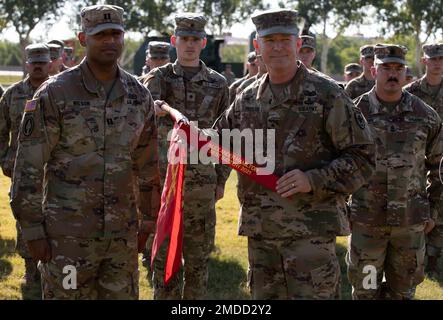 Capt. Zebadiah Wilson, commander of Battery B, 1st Battalion, 158th Field Artillery Regiment, 45th Field Artillery Brigade, and Brig. Gen. Andrew Preston, commandant of the United States Army Field Artillery School, pose for a picture showcasing the Alexander Hamilton Award streamer on the company guidon on July 16, 2022. The Alexander Hamilton Award is presented annually to the best field artillery unit  in the National Guard. (Oklahoma National Guard photo by Spc. Caleb Stone) Stock Photo