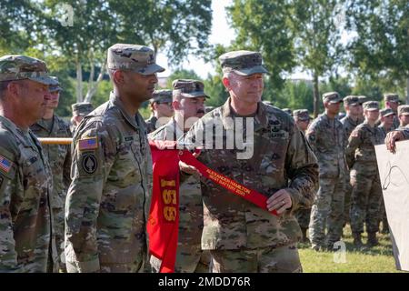 Brig. Gen. Andrew Preston, field artillery commandant, Field Artillery School, right, and Capt. Zebadiah Wilson, Bravo Battery, 1st Battalion, 158th Field Artillery Regiment commander, hand the streamer for the Alexander Hamilton Award on the battery's guidon. Stock Photo