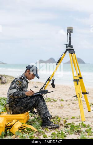 220720-N-N0842-5007-AU  BELLOWS AIR FORCE STATION (July 15, 2022) Royal Australian Navy Able Seaman Thomas Baddome, from the Deployable Geospatial Survey Team prepares to conduct beach surface surveying activity during Rim of the Pacific (RIMPAC) 2022. Twenty-six nations, 38 ships, three submarines, more than 170 aircraft and 25,000 personnel are participating in RIMPAC from June 29 to Aug. 4 in and around the Hawaiian Islands and Southern California. The world's largest international maritime exercise, RIMPAC provides a unique training opportunity while fostering and sustaining cooperative re Stock Photo