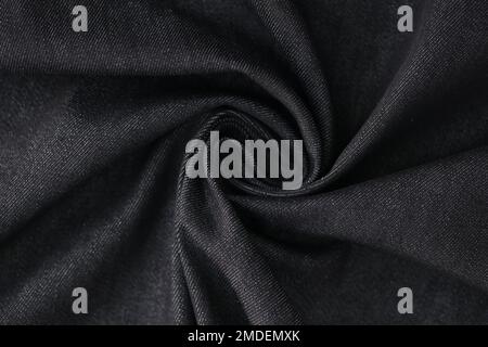 Swirled gray denim fabric as background. Stock Photo