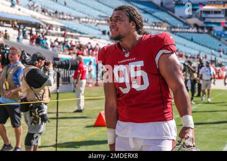 Arizona Cardinals defensive tackle Leki Fotu (95) looks up at a replay  during an NFL football game against the Cincinnati Bengals, Friday, Aug.  12, 2022, in Cincinnati. (AP Photo/Zach Bolinger Stock Photo - Alamy