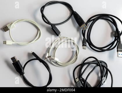 Various types of different ports of charging cables Stock Photo