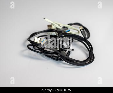 Various type os charging wire for mobile phones isolated white background Stock Photo