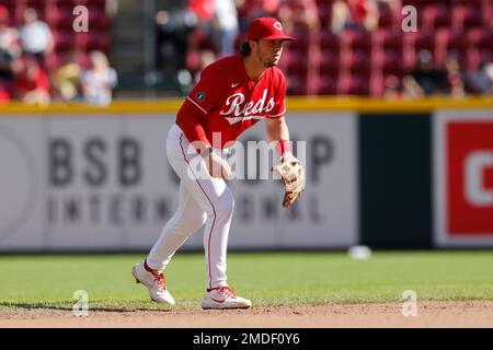 Cincinnati Reds' Kyle Farmer hits an RBI single during the fourth inning of  the team's baseball game against the Arizona Diamondbacks in Cincinnati,  Tuesday, April 20, 2021. (AP Photo/Aaron Doster Stock Photo 