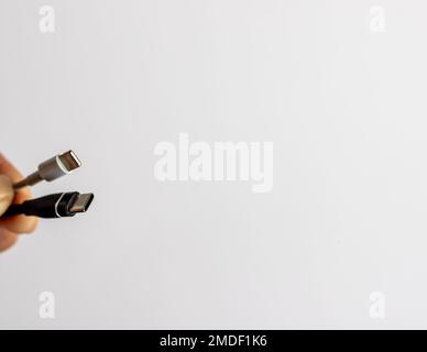 USB C and lighting cable on white isolated background Stock Photo
