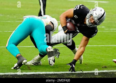 Las Vegas Raiders fullback Alec Ingold (45) leaps over New York