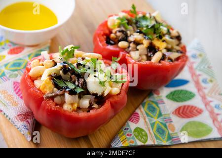 Tomatoes stuffed with beans and anchovies. Stock Photo