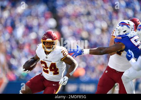 Washington Football Team's Antonio Gibson (24) rushes during the first half  of an NFL football game against the Buffalo Bills Sunday, Sept. 26, 2021,  in Orchard Park, N.Y. (AP Photo/Adrian Kraus Stock