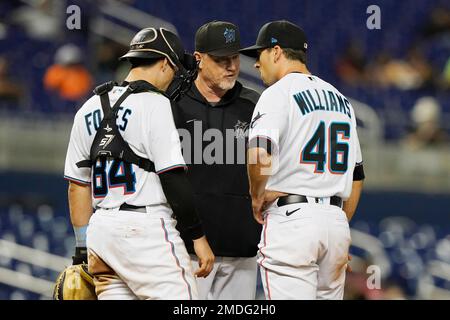 Miami Marlins pitching coach Mel Stottlemyre, center, talks with pitcher  Elieser Hernandez (57) during the first inning of the team's baseball game  against the Pittsburgh Pirates, Friday, Sept. 17, 2021, in Miami. (