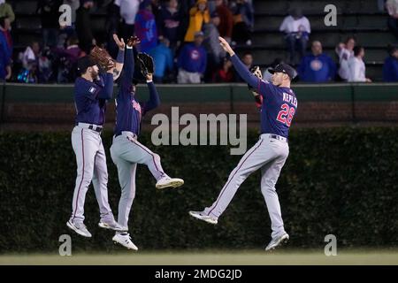 Minnesota Twins' Nick Punto (8) and Carlos Gomez, right, celebrate the Twins'  5-3 win over the Chicago White Sox during a baseball game Tuesday, July 28,  2009, in Minneapolis. (AP Photo/Tom Olmscheid