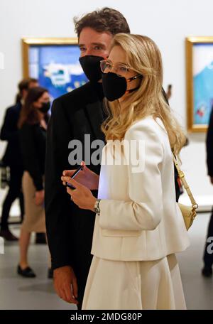 LVMH luxury group CEO Bernard Arnault, center, flanked by his daughter  Delphine Arnault, left, and his son Antoine Arnault as they attend the  opening of the exhibition 'The Morozov Collection, Icons of