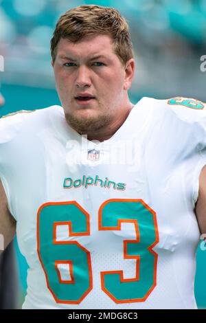 Miami Dolphins guard Michael Deiter (63) heads onto the field for warmups  before the start of a NFL preseason football game against the Las Vegas  Raiders, Saturday, Aug. 20, 2022, in Miami