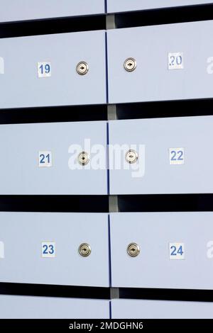Blue mailbox doors with numbers closeup, background Stock Photo