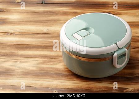 New empty plastic lunch box on a wooden background Stock Photo