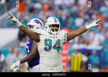 Miami Dolphins defensive tackle Christian Wilkins throws out a ceremonial  first pitch before the start of a baseball game between the Miami Marlins  and the Texas Rangers, Thursday, July 21, 2022, in