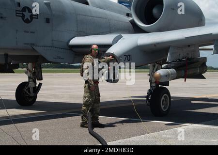 U.S. Air Force Tech. Sgt. Joshua Johnston, 75th Fighter Generation Squadron aircraft turnaround supervisor, refuels an A-10C Thunderbolt II during exercise Agile Flag 22-2 at MacDill Air Force Base, Florida, July 23, 2022. Agile Flag 22-2 is Air Combat Command’s first lead-wing certification event designed to demonstrate the 23rd Wing’s capability to generate combat air power while continuing to move, maneuver, and sustain the Wing and subordinate force elements in a dynamic and contested environment. (U.S. Airman 1st Class Rachel Coates) Stock Photo