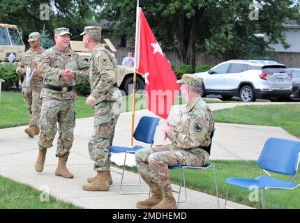 The outgoing Commanding General, Maj. Gen. Matthew V. Baker, shares a moment with incoming Commanding General, Maj. Gen. Brian E. Miller, during the change of command ceremony at the Veterans Memorial Park in Bartlett, Illinois, July 24. Stock Photo