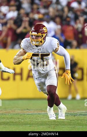 Landover, United States. 25th Oct, 2020. Dallas Cowboys quarterback Andy  Dalton (14) evades Washington Football Team linebacker Cole Holcomb (55)  during the first half of an NFL football game at FedEx Field