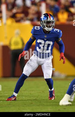 New York Giants cornerback Darnay Holmes (30) warms up before playing  against the Houston Texans in an NFL football game, Sunday, Nov. 13, 2022,  in East Rutherford, N.J. (AP Photo/John Minchillo Stock