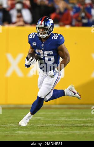 New York Giants running back Saquon Barkley (26) runs the ball during the  first half of an NFL football game against the Washington Football Team,  Thursday, Sept. 16, 2021, in Landover, Md. (