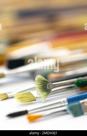 Paint brushes stained with paint, close-up, macro shot. Stock Photo